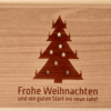 Weihnachtskarte aus Holz mit Christbaum und ausgestanzten Sternen