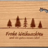 Weihnachtskarte aus Holz mit Tannenwald und herausgelasertem Stern